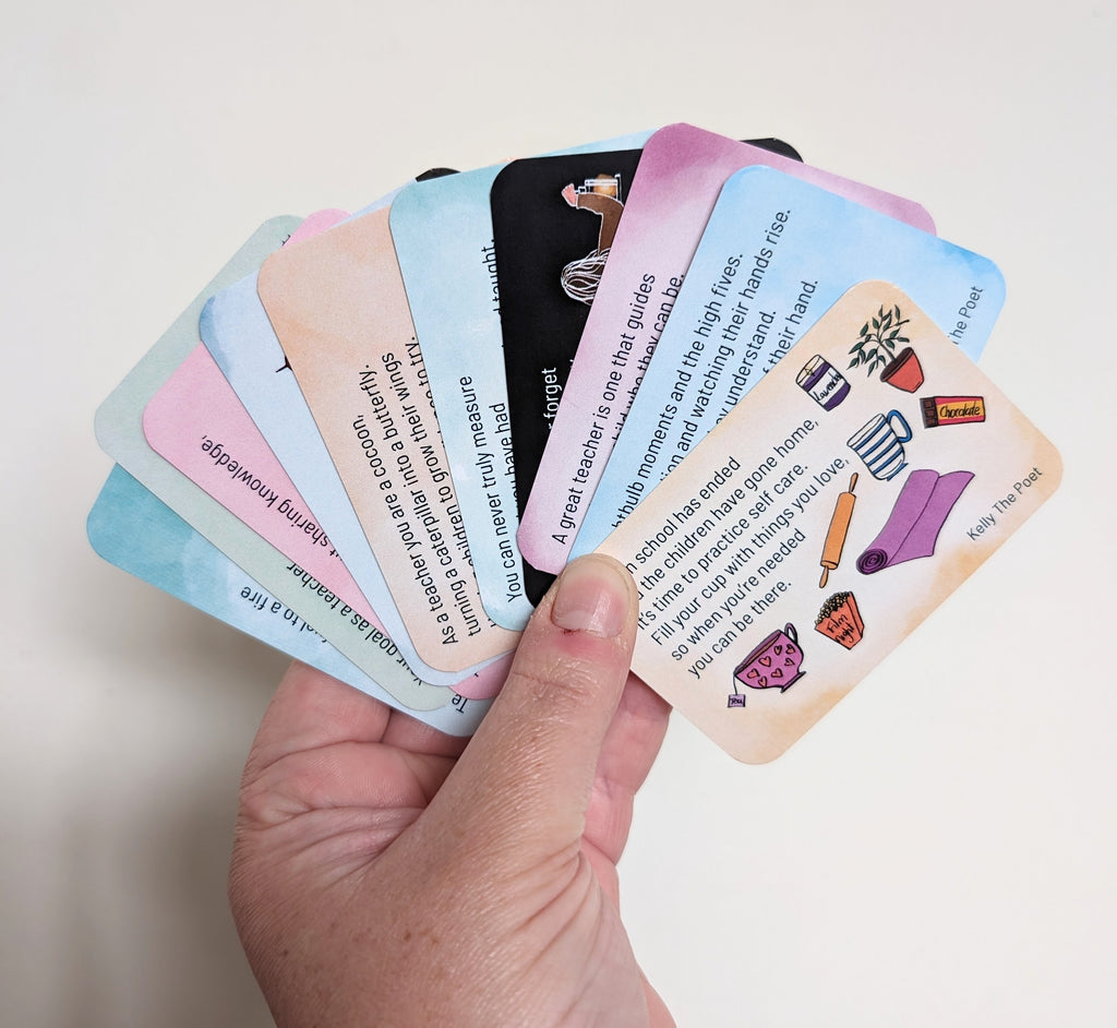 A hand holding a series of colorful index cards with poems, each card having a different design and text.